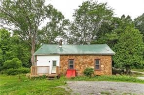 2505 Parkwood Rd, Armstrong/Shelocta, PA 15774 - rear view of house featuring a deck, a chimney, a yard, and metal roof