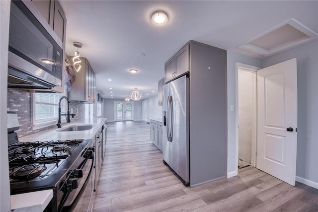 22 Cross Creek Rd, Cross Creek Twp, PA 15312 - kitchen featuring appliances with stainless steel finishes, a sink, light wood-style flooring, recessed lighting, and baseboards