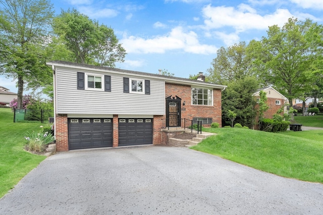 8555 Roosevelt Blvd, Mccandless, PA 15237 - raised ranch with asphalt driveway, a garage, brick siding, and a chimney