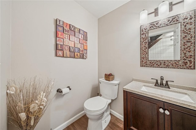 436 Allenberry Dr, Ross Twp, PA 15237 - bathroom with toilet, wood finished floors, vanity, and baseboards