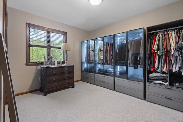 carpeted bedroom featuring baseboards