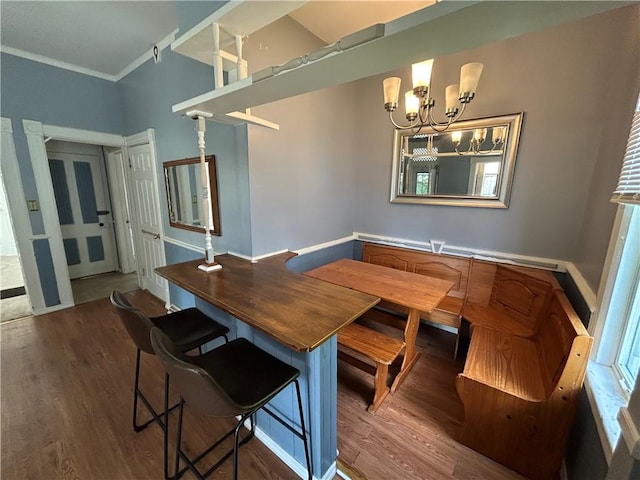 411 Cherry St, City Of But Ne, PA 16001 - dining space with wood finished floors, breakfast area, a chandelier, and ornamental molding