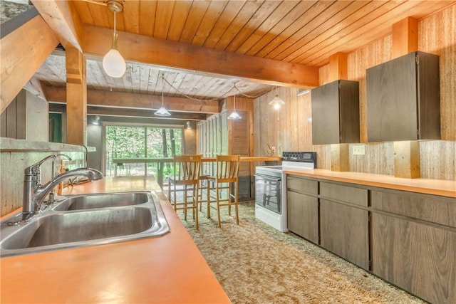1445 E Cruikshank Rd, Valencia Boro, PA 16059 - kitchen featuring white stove, a wood ceiling with exposed beams, carpet flooring, decorative light fixtures, and light countertops