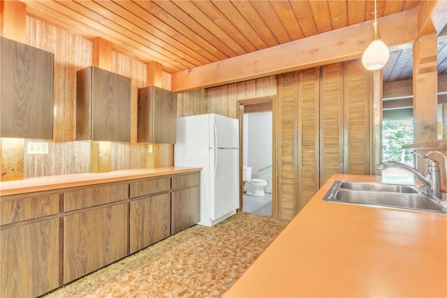 1445 E Cruikshank Rd, Valencia Boro, PA 16059 - kitchen with a sink, freestanding refrigerator, wooden ceiling, light countertops, and decorative light fixtures