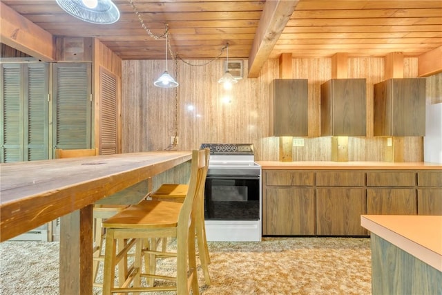 1445 E Cruikshank Rd, Valencia Boro, PA 16059 - kitchen with white electric stove, wooden ceiling, light countertops, brown cabinets, and pendant lighting