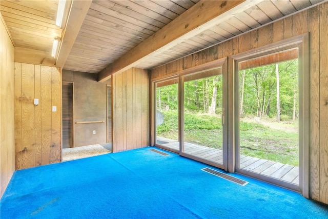 1445 E Cruikshank Rd, Valencia Boro, PA 16059 - carpeted empty room featuring wooden walls and a wooden ceiling with exposed beams