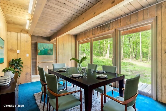 1445 E Cruikshank Rd, Valencia Boro, PA 16059 - carpeted dining space featuring wood walls and a wooden ceiling with exposed beams