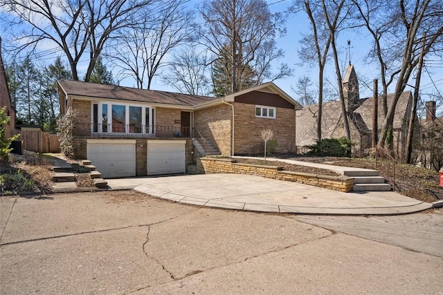7134 Roycrest Pl, Point Breeze, PA 15208 - view of front facade with concrete driveway, an attached garage, brick siding, and central air condition unit