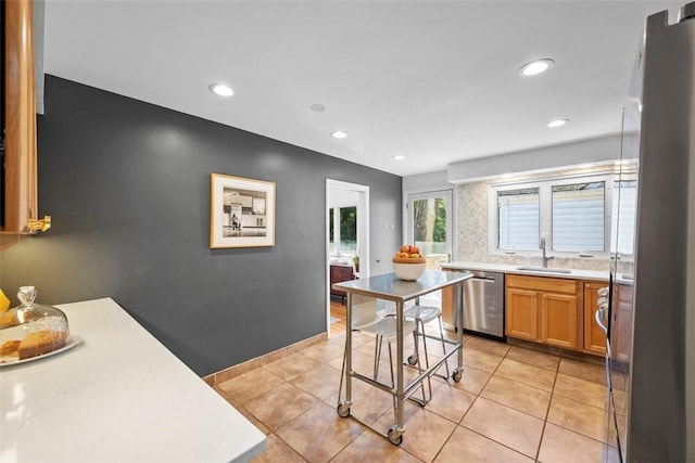 7134 Roycrest Pl, Point Breeze, PA 15208 - kitchen featuring dishwasher, a sink, light countertops, recessed lighting, and light tile patterned floors