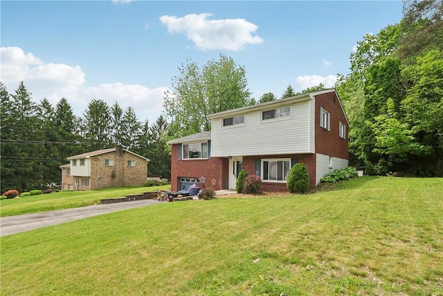 142 Meadowbrook Dr, Moon/Crescent Twp, PA 15108 - split level home featuring asphalt driveway, an attached garage, brick siding, and a front lawn