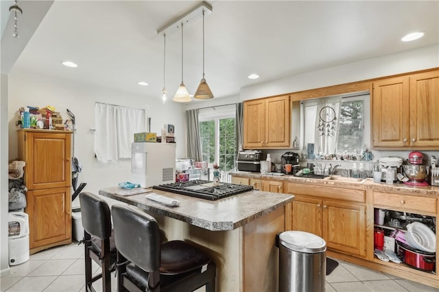 142 Meadowbrook Dr, Moon/Crescent Twp, PA 15108 - kitchen with gas cooktop, a sink, light tile patterned floors, a kitchen island, and light countertops