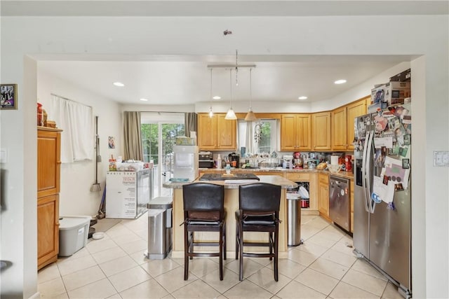 142 Meadowbrook Dr, Moon/Crescent Twp, PA 15108 - kitchen featuring stainless steel appliances, a center island, a kitchen breakfast bar, light tile patterned floors, and hanging light fixtures