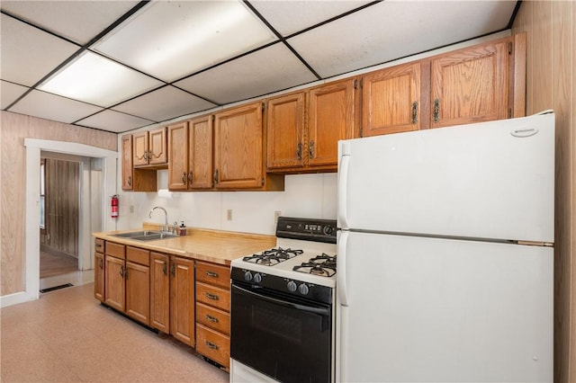 250 E Neshannock Ave, New Wilmington Boro, PA 16142 - kitchen with freestanding refrigerator, gas range, a sink, light countertops, and light floors