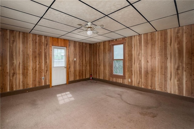 250 E Neshannock Ave, New Wilmington Boro, PA 16142 - empty room with wooden walls, a drop ceiling, carpet, and baseboards