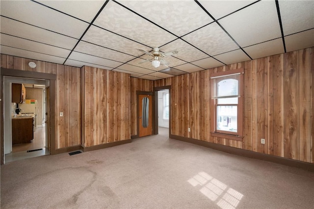 250 E Neshannock Ave, New Wilmington Boro, PA 16142 - unfurnished room with wood walls, carpet floors, and a paneled ceiling