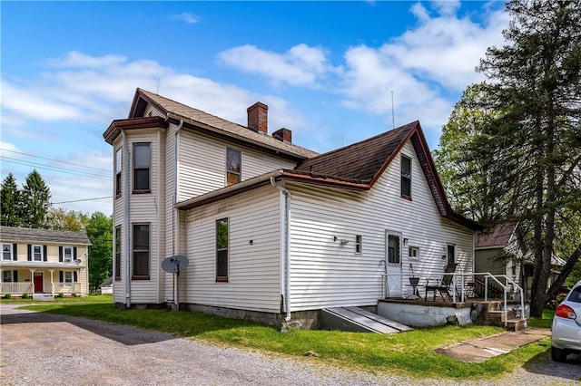 250 E Neshannock Ave, New Wilmington Boro, PA 16142 - view of side of home with a chimney and roof with shingles