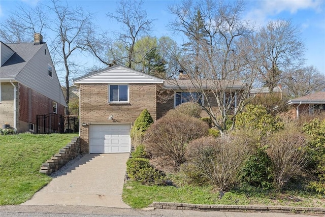 235 Mcmonagle Ave, Scott Twp Sal, PA 15220 - view of front of home featuring brick siding, concrete driveway, an attached garage, and a front yard