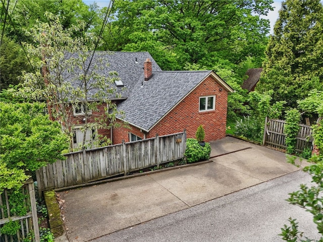 1017 Lancaster Ave, Regent Square, PA 15218 - view of home's exterior with brick siding and roof with shingles