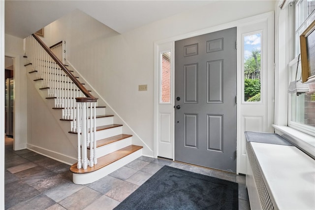 1017 Lancaster Ave, Regent Square, PA 15218 - entryway featuring baseboards, stairs, and stone finish floors
