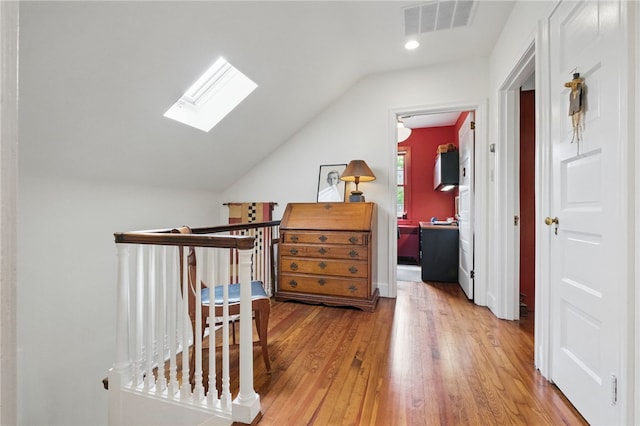 1017 Lancaster Ave, Regent Square, PA 15218 - corridor with a skylight, vaulted ceiling, wood finished floors, and recessed lighting