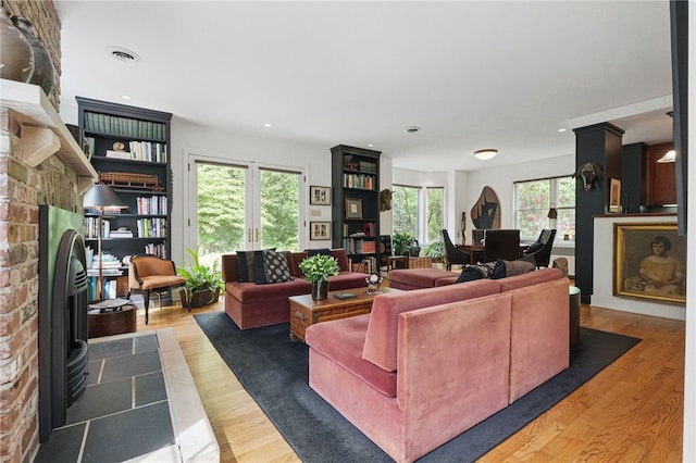 1017 Lancaster Ave, Regent Square, PA 15218 - living area with wood finished floors, plenty of natural light, recessed lighting, and a fireplace