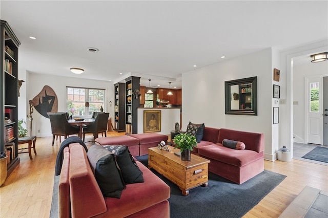 1017 Lancaster Ave, Regent Square, PA 15218 - living room with light wood finished floors, healthy amount of natural light, and recessed lighting
