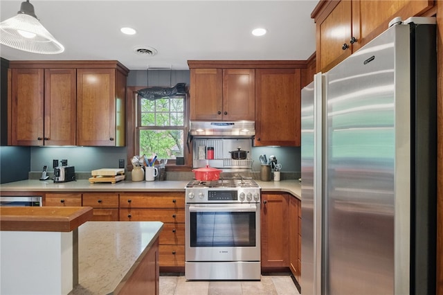 1017 Lancaster Ave, Regent Square, PA 15218 - kitchen featuring stainless steel appliances, under cabinet range hood, brown cabinetry, and recessed lighting