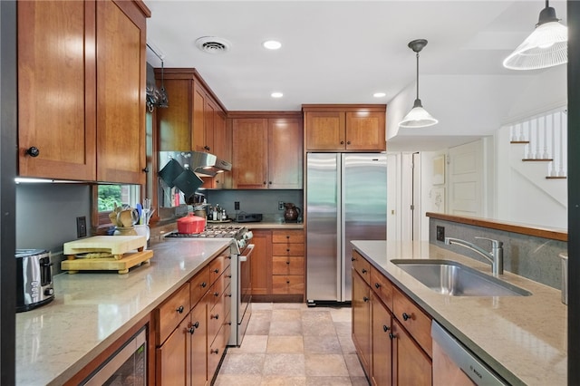 1017 Lancaster Ave, Regent Square, PA 15218 - kitchen featuring built in appliances, a sink, brown cabinets, recessed lighting, and light stone countertops