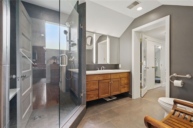 1017 Lancaster Ave, Regent Square, PA 15218 - bathroom featuring lofted ceiling, a shower stall, vanity, toilet, and tile patterned floors