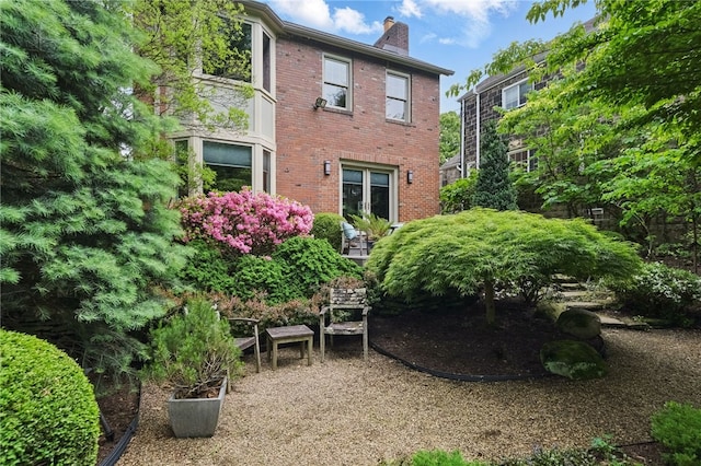 1017 Lancaster Ave, Regent Square, PA 15218 - rear view of property featuring a chimney and brick siding