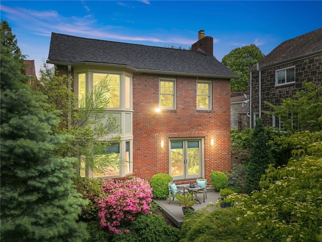 1017 Lancaster Ave, Regent Square, PA 15218 - back of house featuring a chimney, roof with shingles, and brick siding