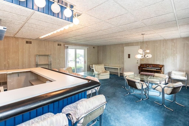 302 Derrick Ave, South Union Twp, PA 15401 - interior space featuring carpet floors, a chandelier, and wooden walls