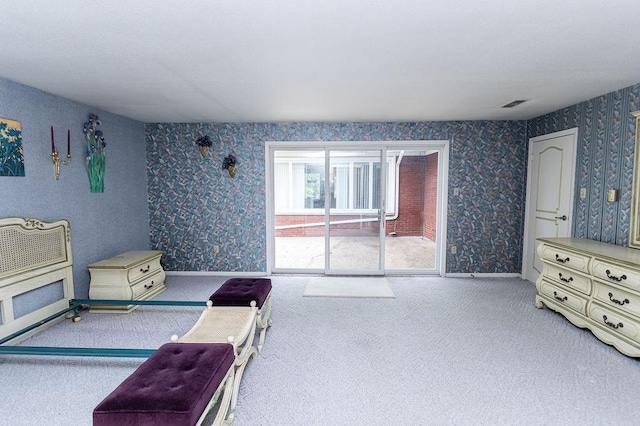 302 Derrick Ave, South Union Twp, PA 15401 - bedroom with wallpapered walls, carpet floors, and access to exterior