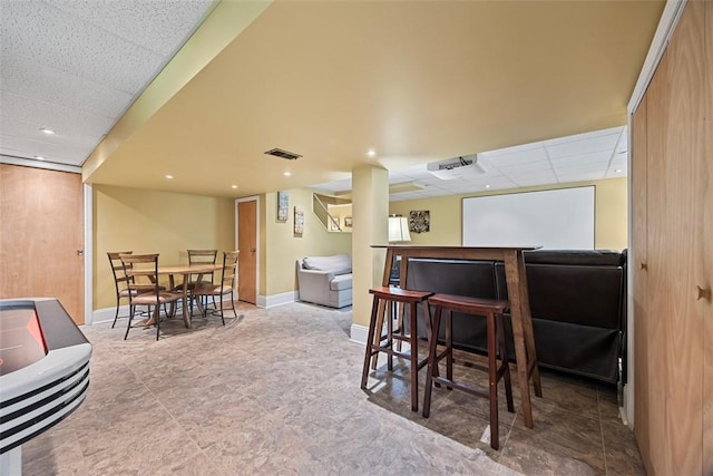 38 Elwyn Ave, Collier Twp, PA 15106 - dining area featuring a paneled ceiling, a bar, and baseboards