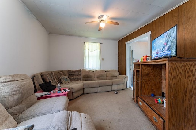 6071 Rte 711, Saint Clair Twp, PA 15944 - living room featuring crown molding, light carpet, ceiling fan, and wood walls