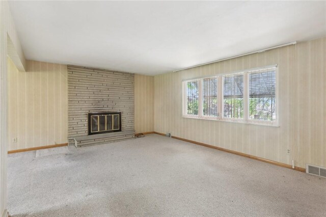 2403 Marion St, Hopewell Twp Bea, PA 15001 - unfurnished living room featuring carpet, a brick fireplace, and baseboards