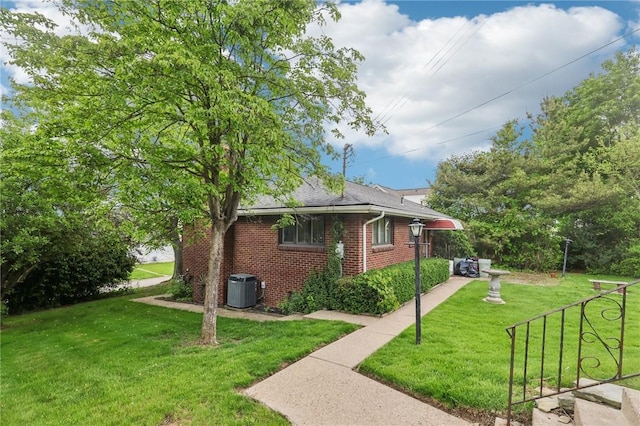2403 Marion St, Hopewell Twp Bea, PA 15001 - view of side of home featuring central air condition unit, brick siding, a lawn, and a shingled roof