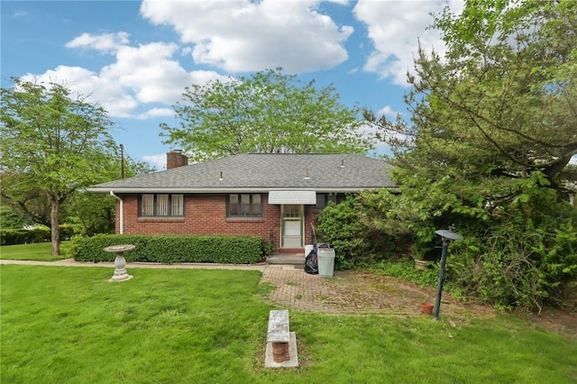 2403 Marion St, Hopewell Twp Bea, PA 15001 - view of front of house with a front lawn, brick siding, a chimney, and roof with shingles