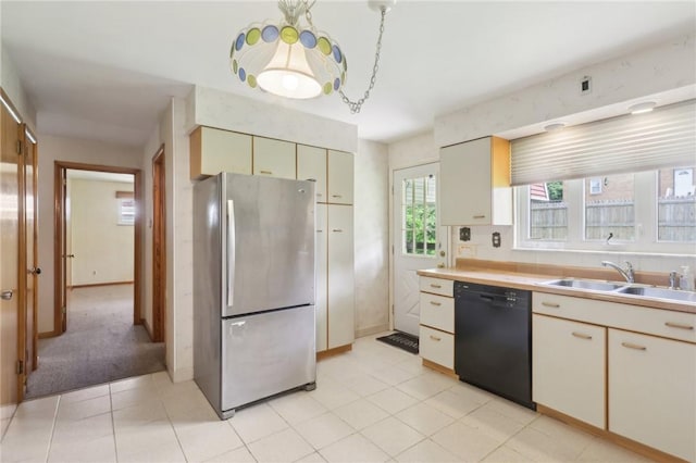 2403 Marion St, Hopewell Twp Bea, PA 15001 - kitchen with freestanding refrigerator, black dishwasher, a sink, and light countertops