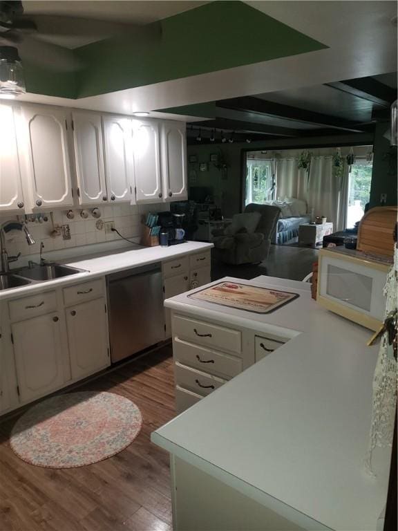 2381 Lake Rd, Jefferson Twp Mer, PA 16150 - kitchen with dishwasher, white microwave, a sink, wood finished floors, and white cabinets