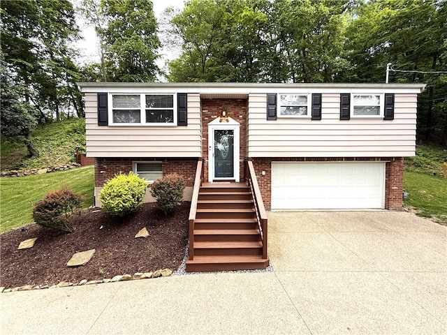815 Semple Ave, Avalon, PA 15202 - raised ranch with a garage, concrete driveway, and brick siding