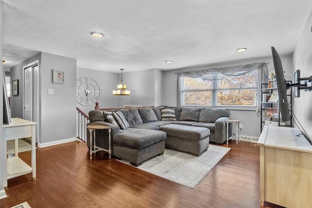 815 Semple Ave, Avalon, PA 15202 - living area with dark wood finished floors, baseboards, and a chandelier