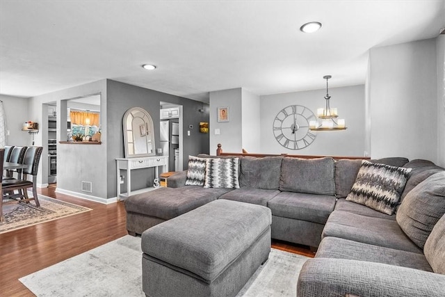 815 Semple Ave, Avalon, PA 15202 - living area with a chandelier, wood finished floors, baseboards, and recessed lighting