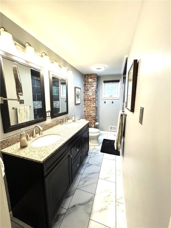 815 Semple Ave, Avalon, PA 15202 - bathroom with toilet, double vanity, marble look tiles, and a shower with shower curtain
