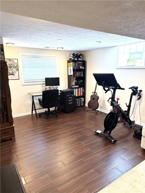 815 Semple Ave, Avalon, PA 15202 - exercise area with a textured ceiling, wood finished floors, and baseboards