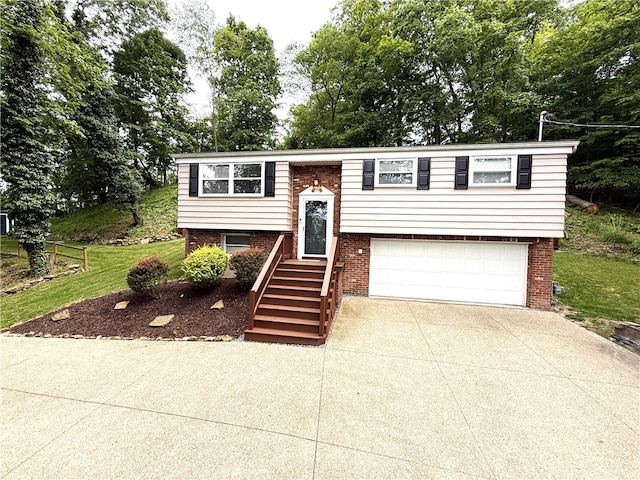 815 Semple Ave, Avalon, PA 15202 - bi-level home featuring a garage, concrete driveway, brick siding, and view of scattered trees