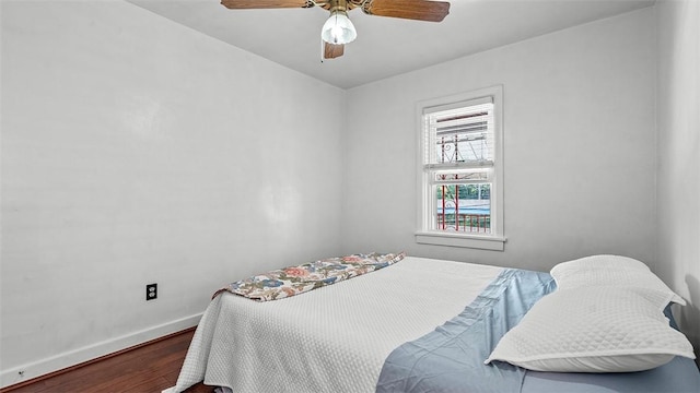 427 W Warrington Ave, Beltzhoover, PA 15210 - bedroom featuring wood finished floors, baseboards, and a ceiling fan