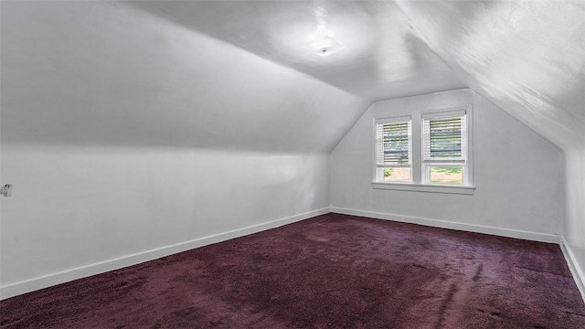427 W Warrington Ave, Beltzhoover, PA 15210 - bonus room featuring vaulted ceiling, dark carpet, and baseboards