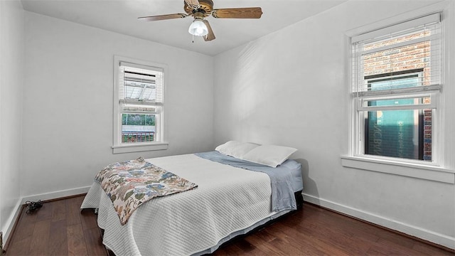 427 W Warrington Ave, Beltzhoover, PA 15210 - bedroom with baseboards, wood finished floors, and ceiling fan