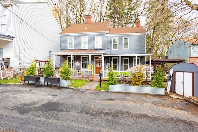 545 Roseland Ave, Ross Twp, PA 15214 - view of front of home with covered porch and a chimney